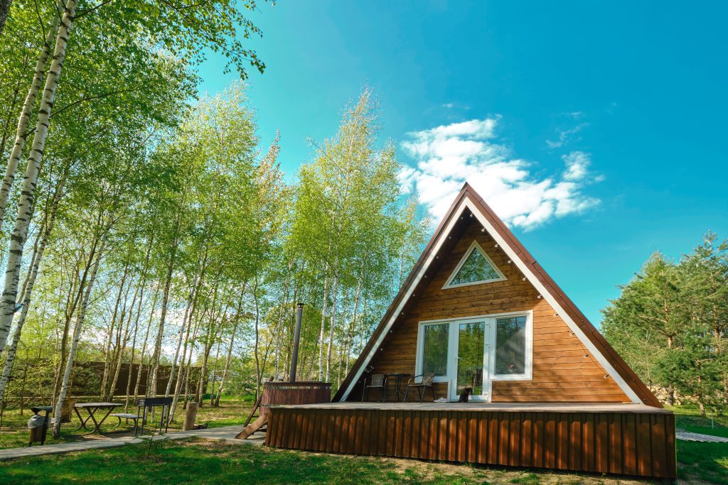 A-Frame and Dome designs carry a common thread of being outside traditional architectural. A-Frame homes have steep pitched roofs while domes are sphere-like and usually comprised of a complex network of triangles.