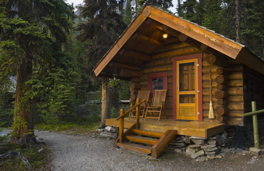 Cabins are usually simple in design and constructed with round logs or natural, hand-worked wood rather than cut boards. Cabins are often located in wooded or secluded areas.